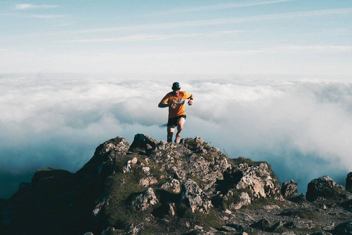 Hiker checking altimeter integration in wearables on rugged trail